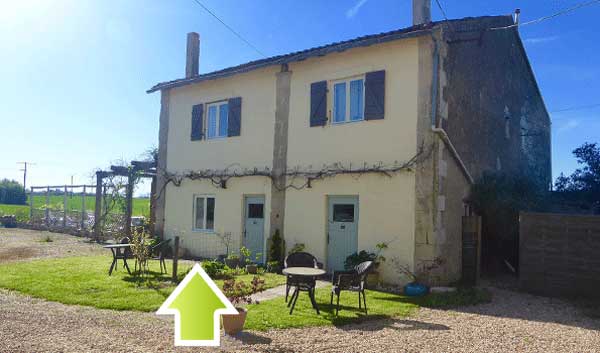 front of french attached gites with arrow pointing to the left hand building, gite Tournesols