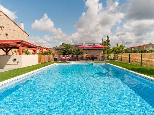 swimming pool with seating at the end