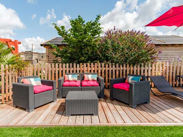 comfortbale summer seating with cushions and parasols