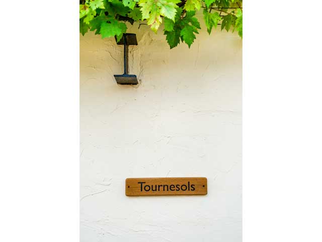 wooden sign reading 'Tournesols' which means sunflowers in French